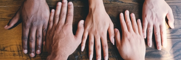 Diverse hands on table
